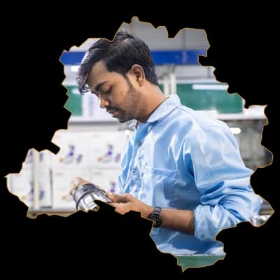 A team member at work, framed in the outline of Delhi