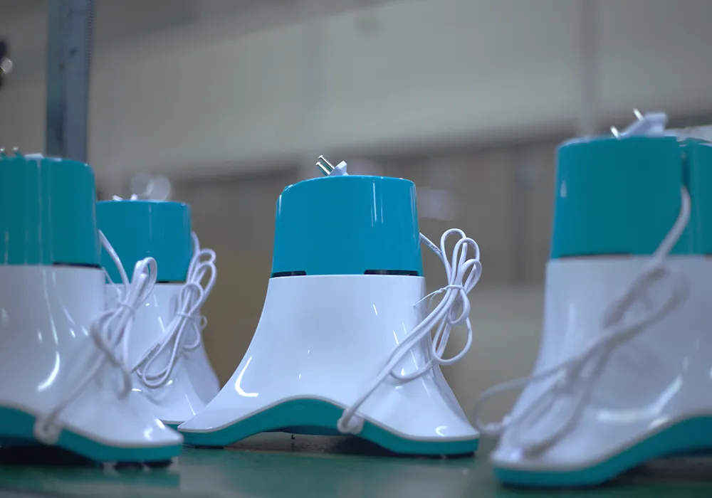 White and teal mixer grinder bases on the line