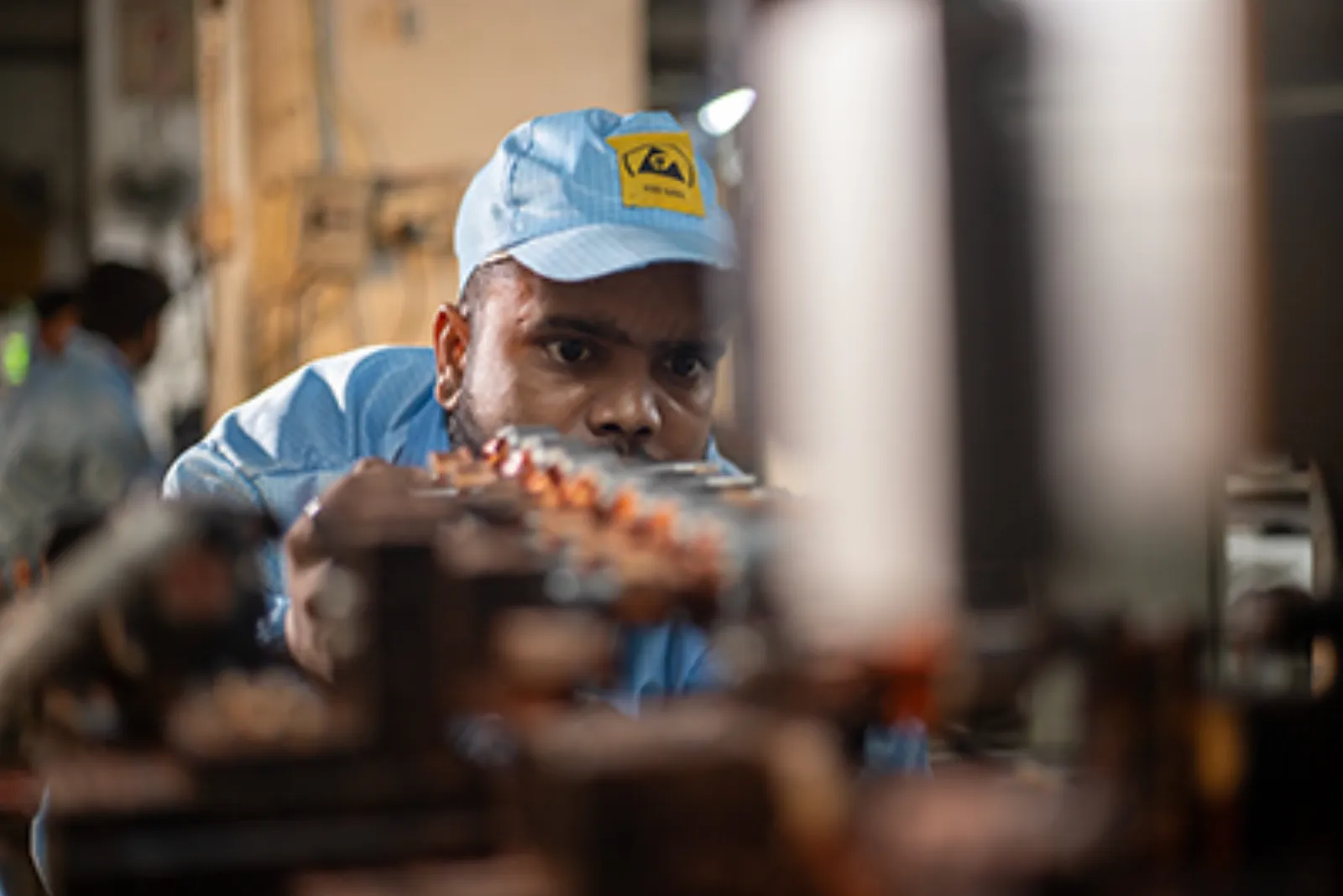A technician checking a product during final development