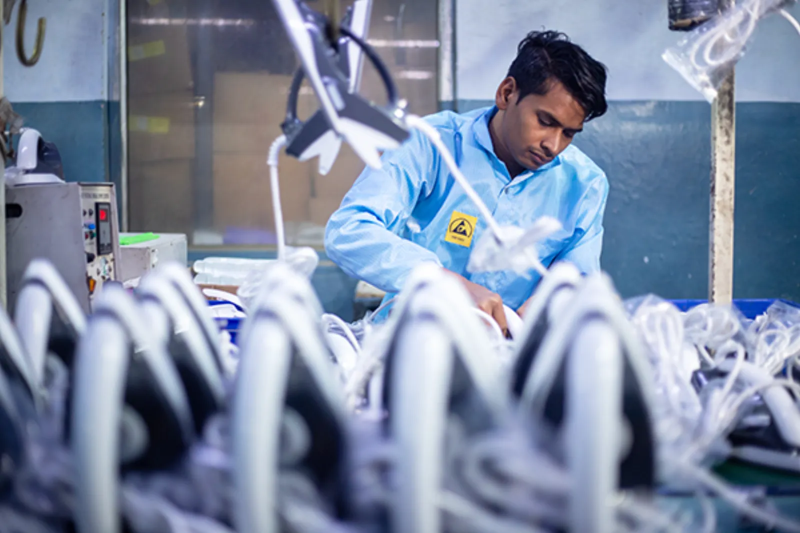 A Vardhman technician working on electric irons
